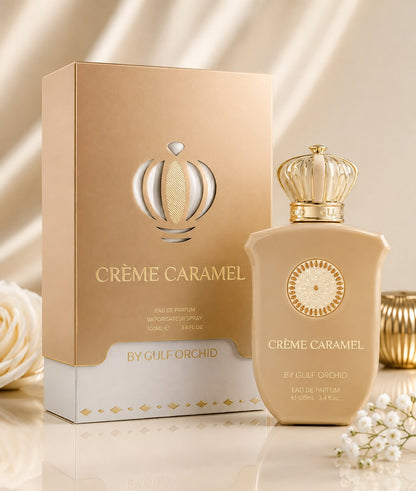 Noor Fragrances Crème Caramel Eau de Parfum bottle and gold box with crown cap on a reflective surface