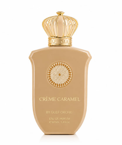Noor Fragrances Crème Caramel Eau de Parfum in a beige bottle with a gold crown cap and intricate gold detailing.