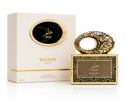 Noor Fragrances Maison Asrar Hilm perfume bottle and box with ornate gold and black Arabic calligraphy design.