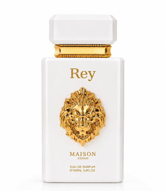 Noor Fragrances Maison Asrar Rey Eau de Parfum in a white bottle with a gold lion emblem on a white background.
