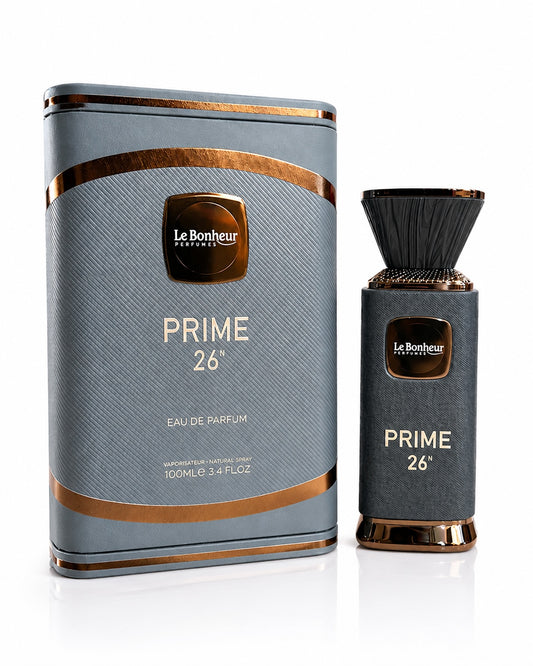 Noor Fragrances Le Bonheur Prime 26 Eau de Parfum bottle and matching charcoal-grey textured box with copper accents.