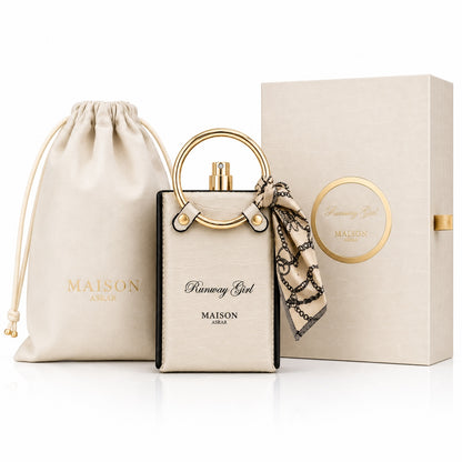 Noor Fragrances Runway Girl perfume bottle with gold ring handle, printed scarf, gift box, and pouch.