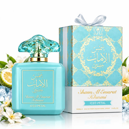 Noor Fragrances Shams Al Emarat Khususi Iced Petal perfume bottle and gift box with turquoise and gold accents.