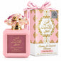 Noor Fragrances Shams Al Emarat Khususi Pink Blush perfume bottle with a sculpted cap and matching floral gift box.