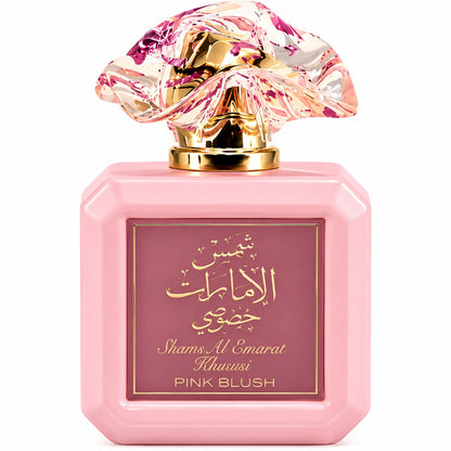 Noor Fragrances Shams Al Emarat Khususi Pink Blush perfume in a square pink bottle with a sculpted floral cap