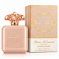Noor Fragrances Shams Al Emarat Glaze & Glow eau de parfum in a blush bottle with a sculptural cap and matching box.