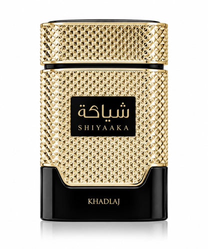 Noor Fragrances KHADLAJ Shiyaaka Gold perfume bottle with a textured gold metallic finish and black base.