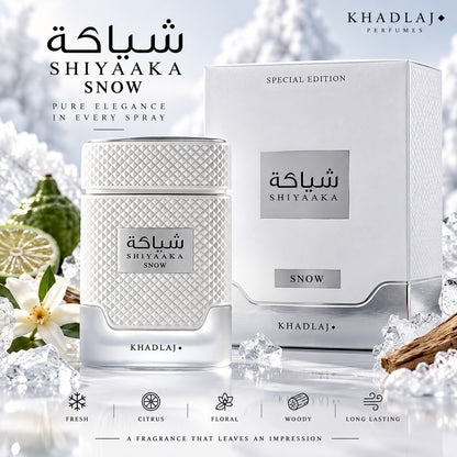 Noor Fragrances KHADLAJ Shiyaaka Snow perfume bottle and box with textured white finish and silver accents on ice