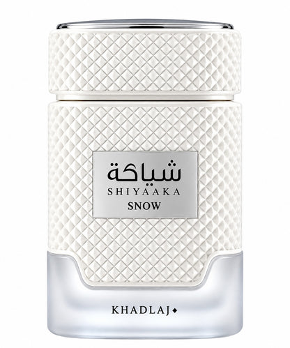 Noor Fragrances KHADLAJ Shiyaaka Snow perfume bottle with a textured white finish and elegant silver accents.