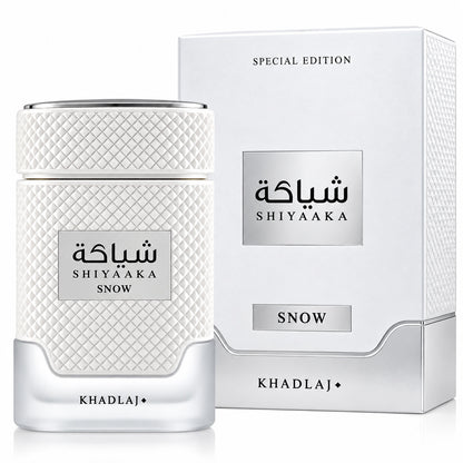 Noor Fragrances Khadlaj Shiyaaka Snow perfume bottle and box with textured white finish and silver accents.