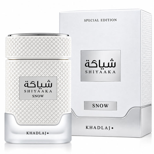 Noor Fragrances Khadlaj Shiyaaka Snow perfume bottle and box with textured white finish and silver accents.