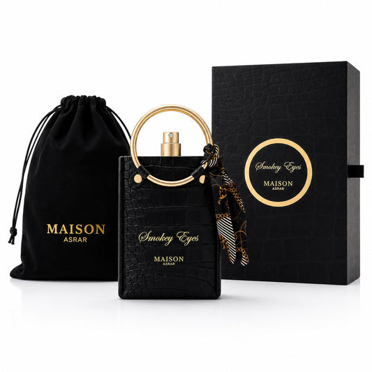 Noor Fragrances Smokey Eyes perfume in a black crocodile-embossed bottle with a gold handle, silk scarf, and gift box.