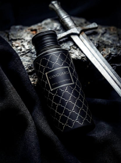 Noor Fragrances Vanguard Royal Collection perfume in a matte black bottle with silver geometric patterns next to a sword.