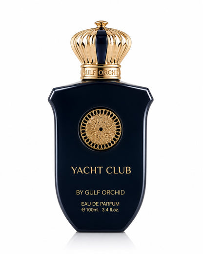 Noor Fragrances Yacht Club Eau De Parfum in a deep navy bottle with gold filigree and a regal crown-shaped cap.